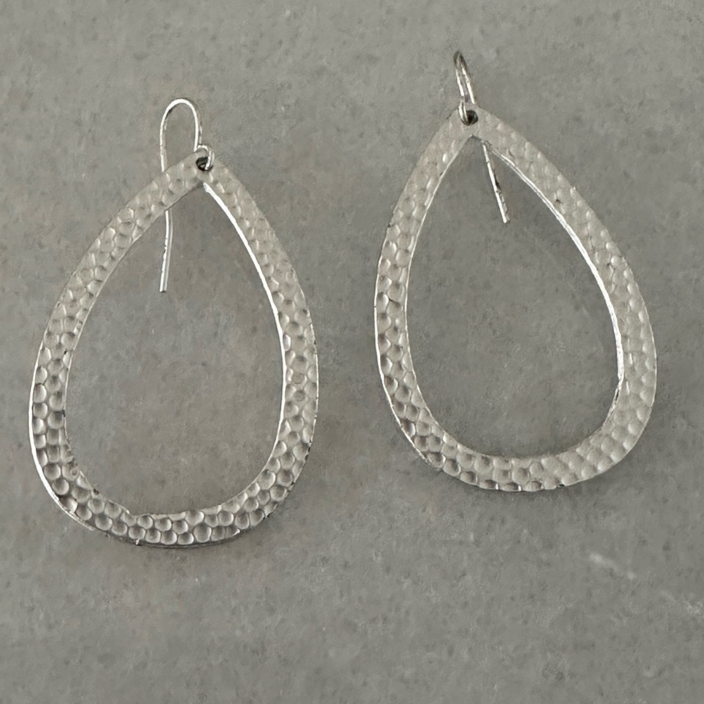 New hammered silver open teardrop shaped earrings.  2.5” long.